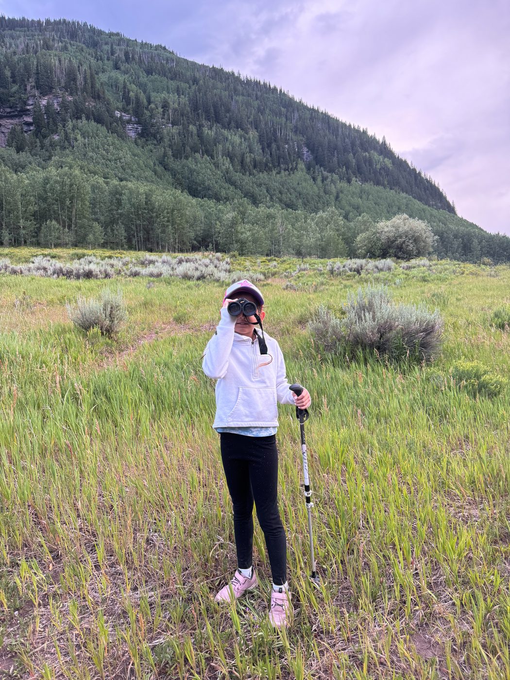 Hadley with binoculars in Colorado